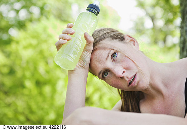 Tired woman with sportdrink