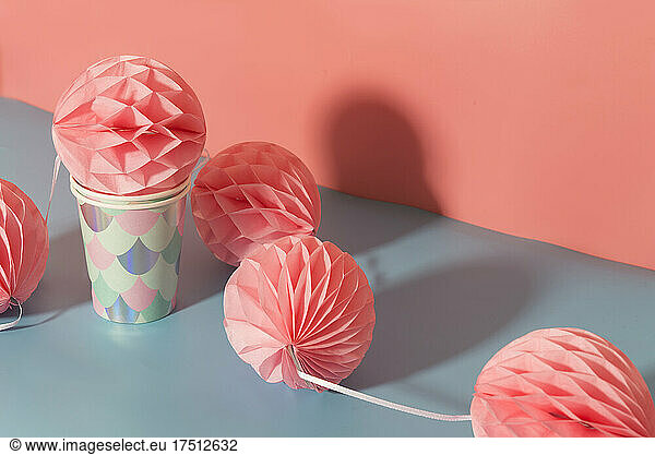 Tissue paper pom-poms and paper cups