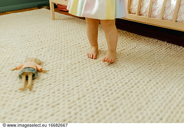 Toddler feet and a rainbow dress