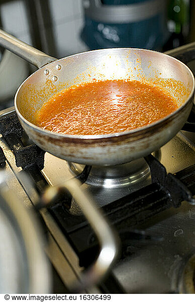 Tomato sauce in a pot at kitchen of Italian restaurant