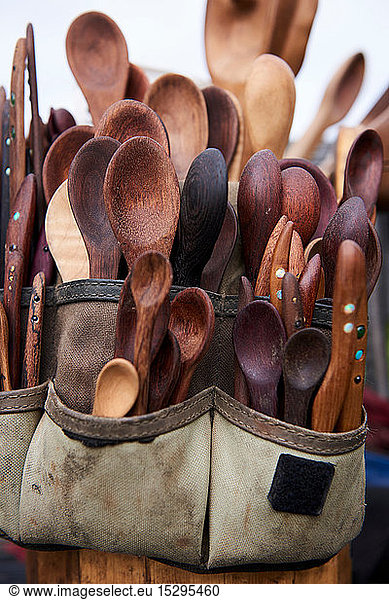 Tool belt filled with wooden spoons and knives