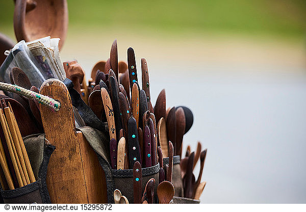 Tool belt filled with wooden spoons and knives