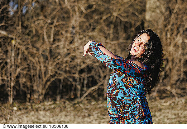 Top half of smiling woman dancing flamenco