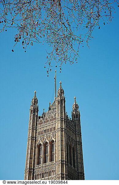 Top of historical tower against blue sky