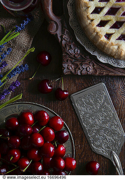top view of cherries and pie on wood shot for copy space