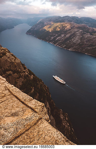 Top view of cruise ship cruising between the fjords in Norway