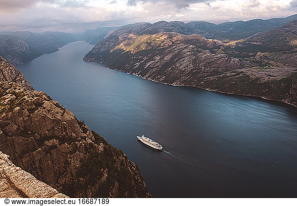 Top view of cruise ship cruising between the fjords in Norway