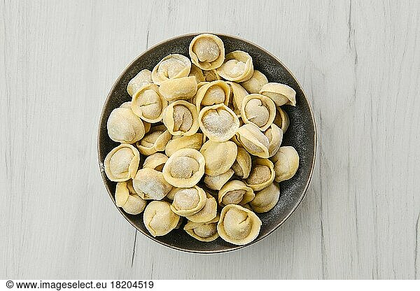 Top view of homemede meat dumplings on white wooden table
