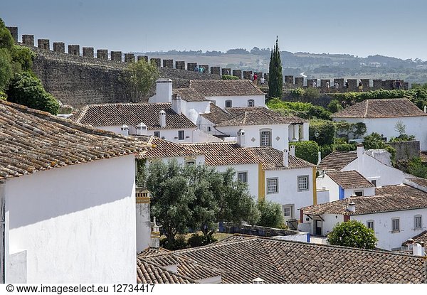 Top view of the ancient fortified village of Obidos and typical terracotta roofs Oeste Leiria District Portugal Europe.