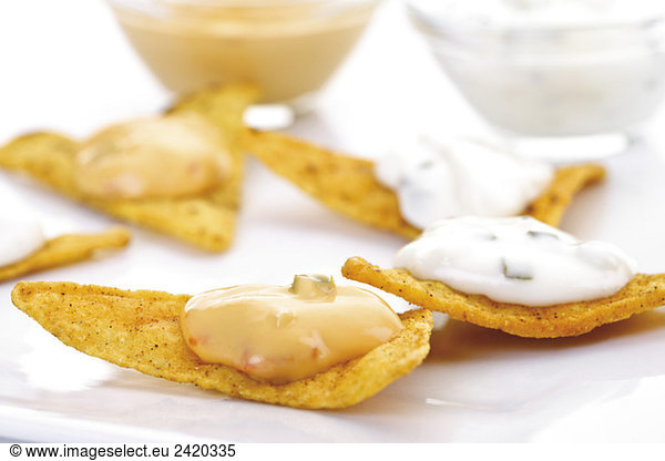 Tortilla Chips with cheese dip and cocktail sauce