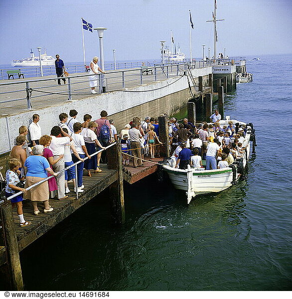 tourism  tourists during boarding of a tourist boat  pier  Heligoland  Germany  1990s  90s  20th century  historic  historical  line of people  waiting line  landing stage  boat bridge  marina  marinas  North Sea  Central Europe  navigation  excursion  boat trip