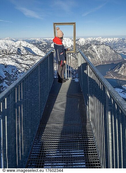 Tourist admires winter landscape at Five Fingers viewpoint  Krippenstein  Salzkammergut  Upper Austria  Austria  Europe