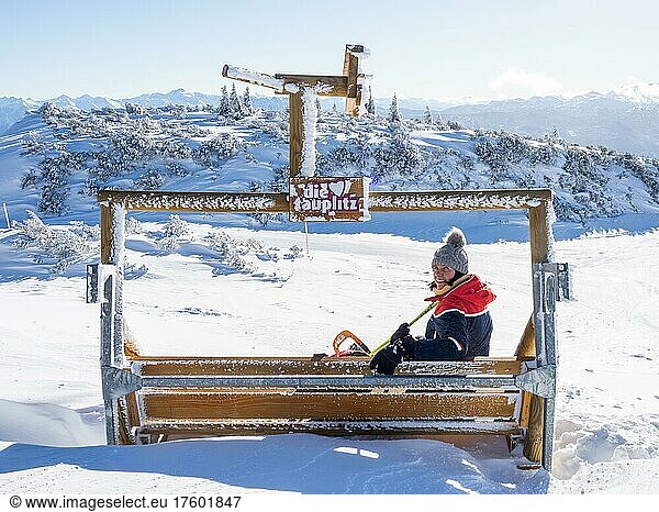 Tourist enjoying the view of snow-covered peaks from the mountain station at Lawinenstein  Tauplitzalm  Styria  Austria  Europe