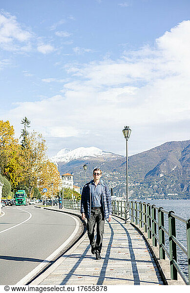 tourist  man  white  walking  November  Lake Como  Tremezzo  Italy