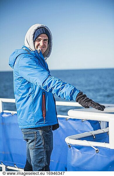 Tourist on a whale watching boat  Reykjavik  Iceland