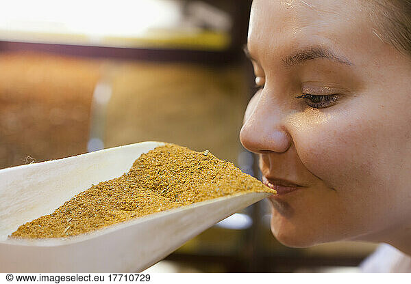 Tourist Smelling The Spices At The Spice Bazaar; Istanbul  Turkey