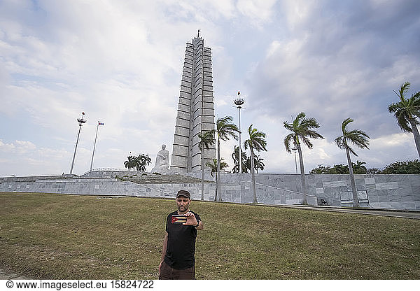 Tourist taking a selfie at the Jose Marti monument  Plaza de la Revolucion  Vedado  Havana  Cuba