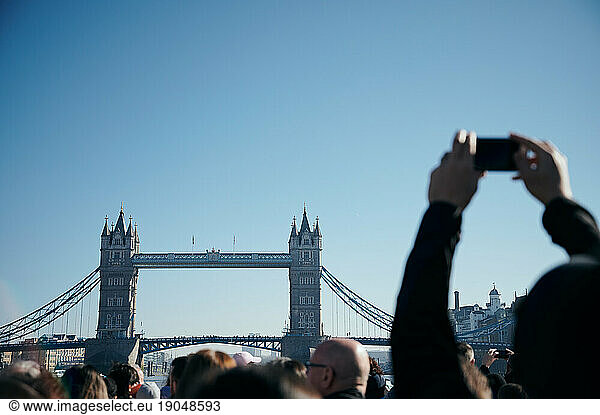 Tourist taking pictures of Tower Bridge