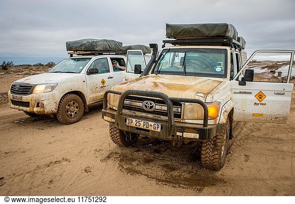 Tourist vehicles driving along Namibia's Skeleton Coast  Africa.