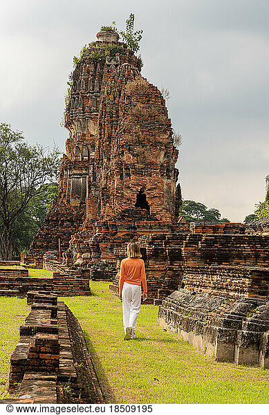 Tourist woman walking inside Bueng Phra Ram Park temple