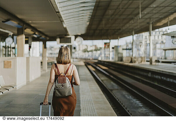 Tourist woman walking inside the train station in Antwerp
