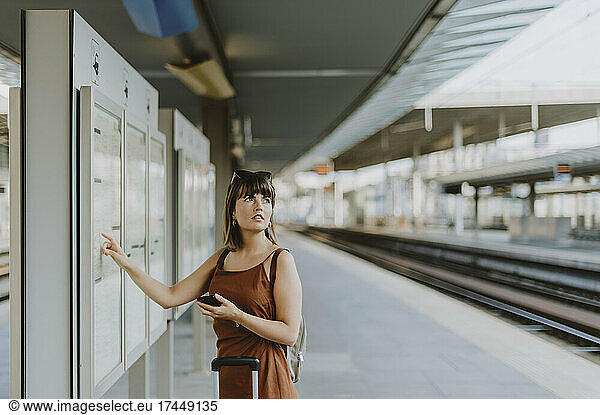 Tourist woman walking inside the train station in Antwerp