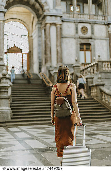 Tourist woman walking inside the train station in Antwerp