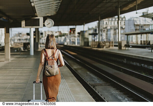 Tourist woman walking inside the train station in Antwerp