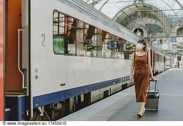 Tourist woman walking inside the train station in Antwerp