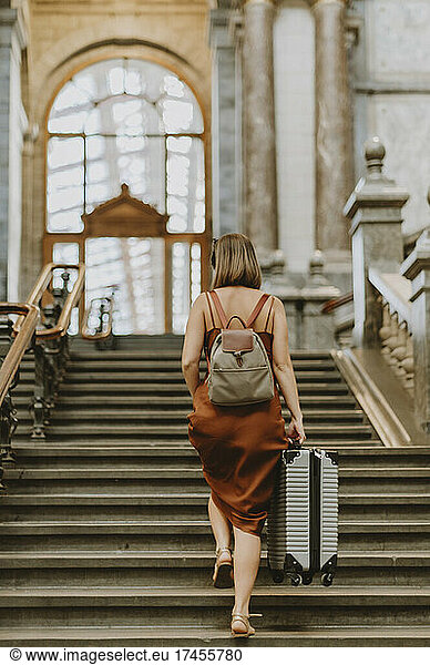 Tourist woman walking inside the train station in Antwerp