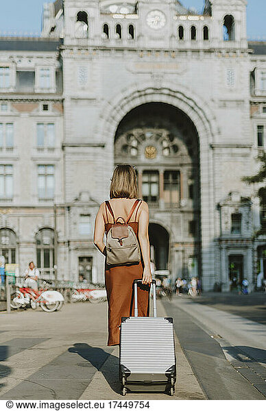 Tourist woman walking outside Antwerp train station