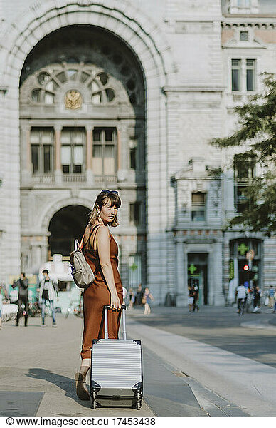 Tourist woman walking outside Antwerp train station