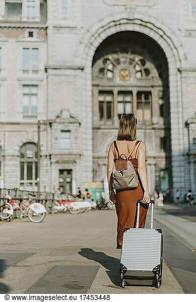 Tourist woman walking outside Antwerp train station