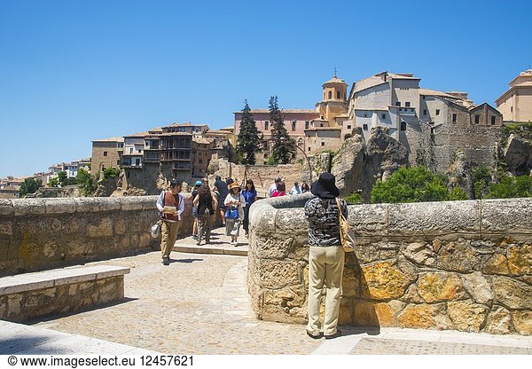 Tourists at San Pablo bridge and overview of the town. Cuenca  Spain.