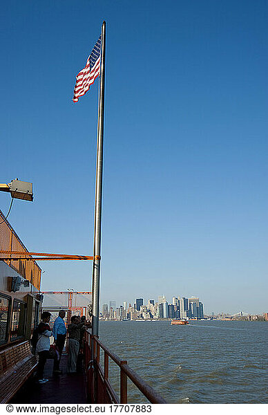 Tourists Enjoying The Views Of Manhattan From The Staten Island Ferry  New York  Usa