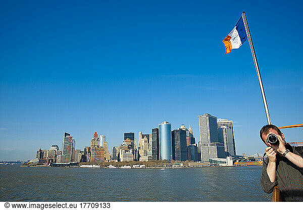Tourists Enjoying The Views Of Manhattan From The Staten Island Ferry  New York  Usa