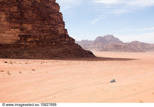 Tourists explore the vastness of the Wadi Rum desert in Jordan.