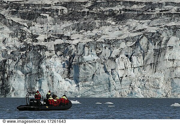 Tourists in zodiac  rubber boat  glacier lake tour  icebergs  floating ice chunks  glacier ice  glacier  calving glacier  glacier lagoon  glacier lake  Jökulsárlon glacier lagoon  Vatnajökull glacier  south coast  Iceland  Europe