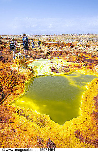 Tourists looking at hot springs and sulphur ponds  Dallol  Danakil Depression  Afar Region  Ethiopia  Africa