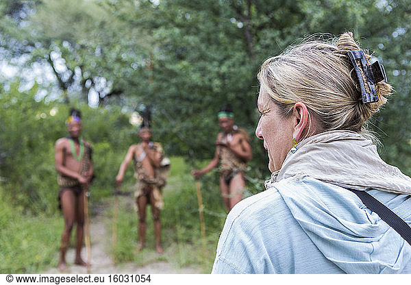 Tourists on a walking trail with members of the San people  bushmen.
