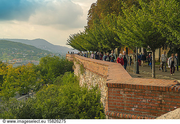 Tourists on the castle hills with view on Buda in Budapest