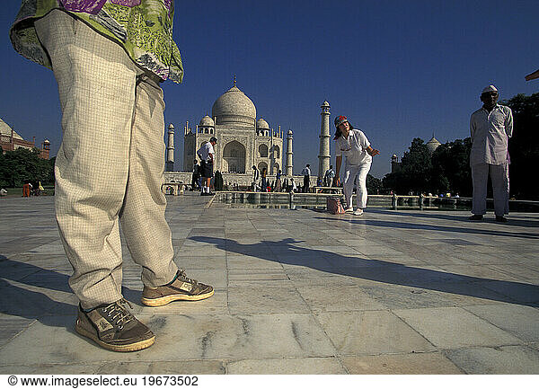 Tourists photograph themselves in front of the Taj Mahal in India.