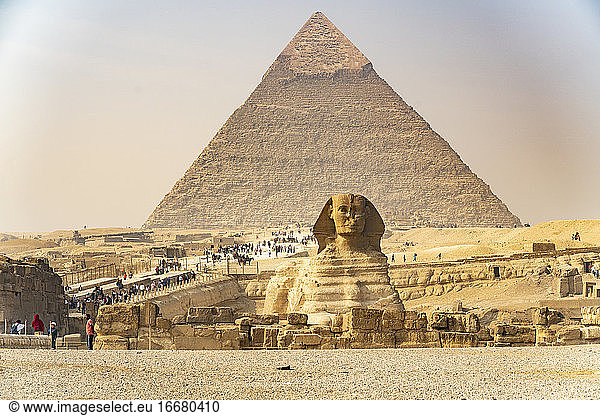 Tourists visit the pyramids and sphinx in Giza  Egypt