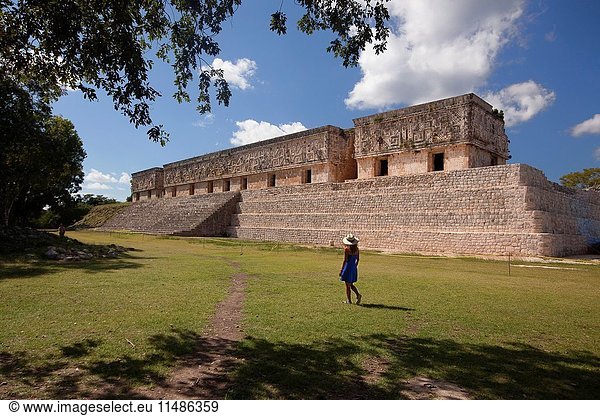 Tourists walking around the Palacio del Gobernador-Governor's Palace  Maya archeological site Uxmal  Yucatan Province  Mexico  Central America