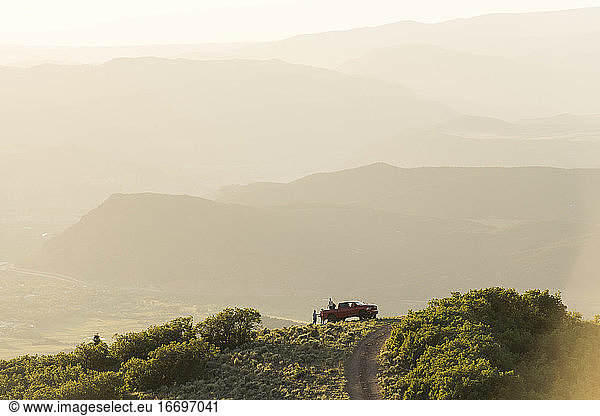 Tourists with off-road vehicle on mountain