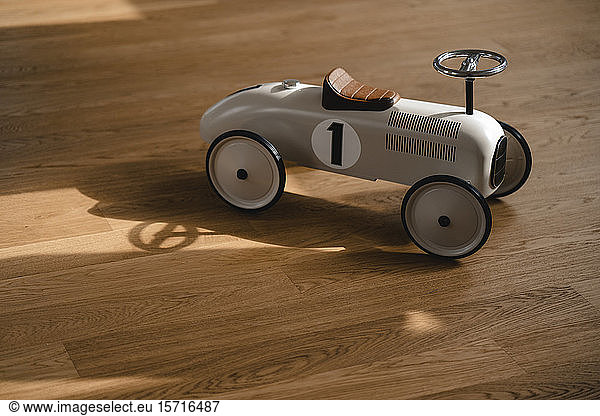 Toy car on wooden floor