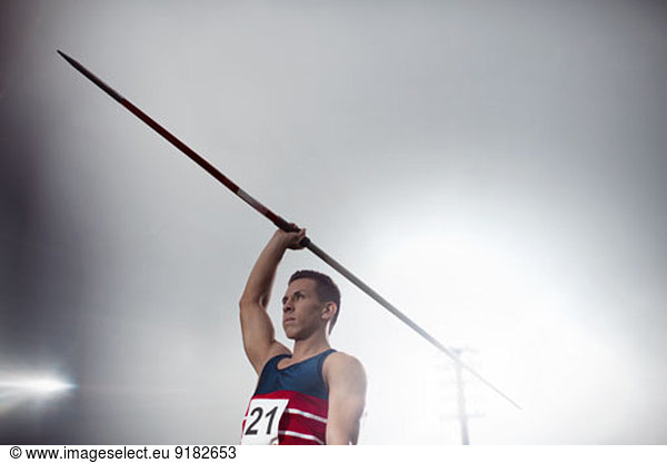 Track and field athlete holding javelin