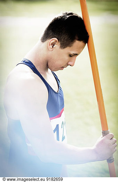 Track and field athlete holding javelin