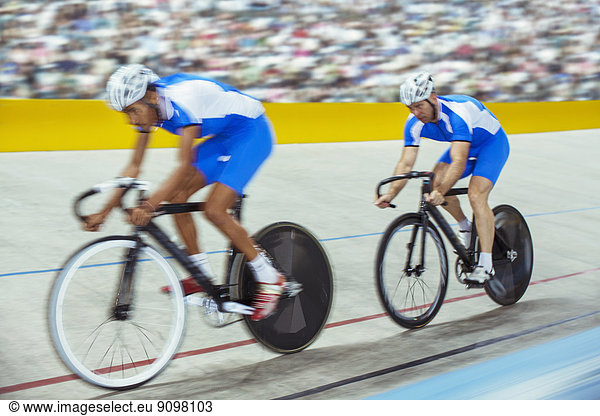 Track cyclists in velodrome