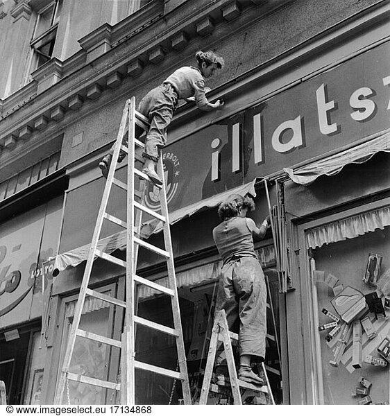 Trade and Commerce:
Painters and Decorators. Women painting the facade of a house in Budapest (Hungary). Photo  1968.